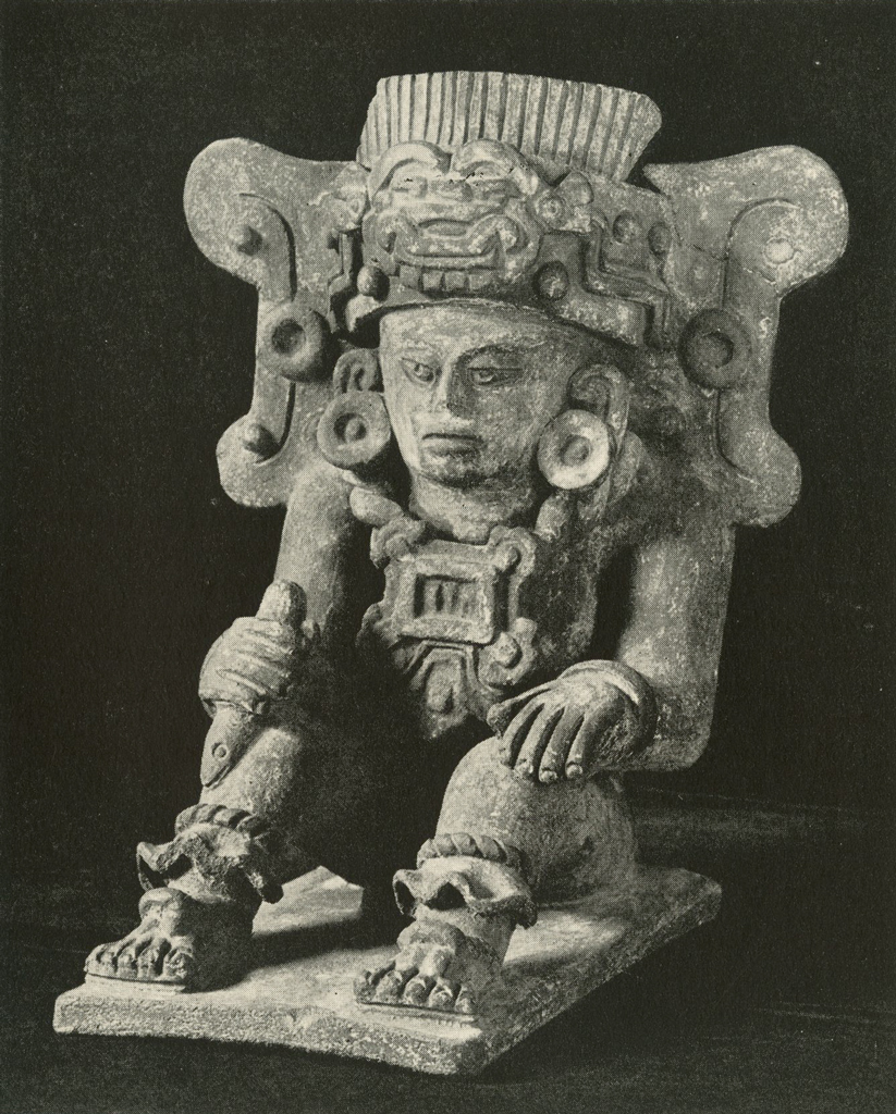 Effigy urn in the shape of a seated man with a rectangular headdress and hands on his knees