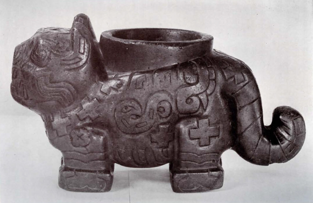 Small puma vessel with geometric motifs, side view showing curled tail