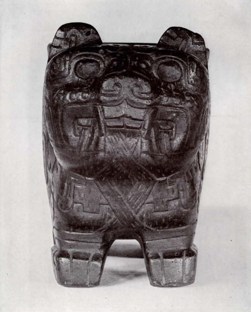 Small puma vessel with geometric motifs, front view showing the face