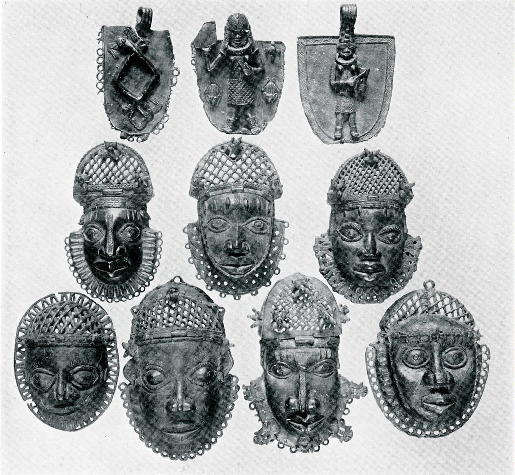 Ten bronze plaques and hip pieces showing heads with criss crossed headpieces