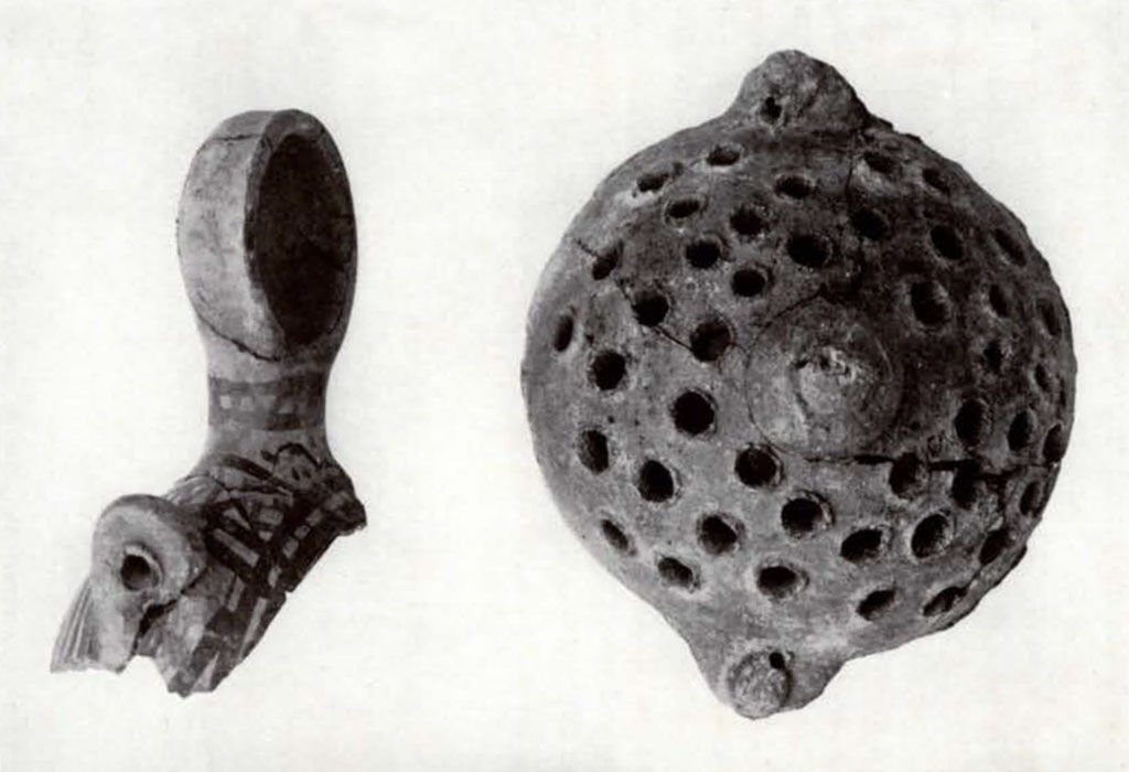 Pieces of a lentoid flask with painted decoration and a colander with large holes