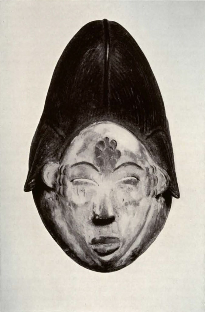 Mask of face with crested hair or headpiece with cicatrization on forehead and temples