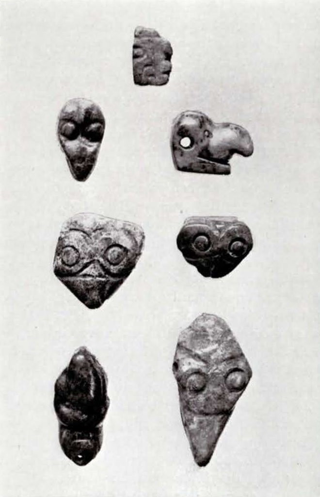 Seven small jade objects in various shapes