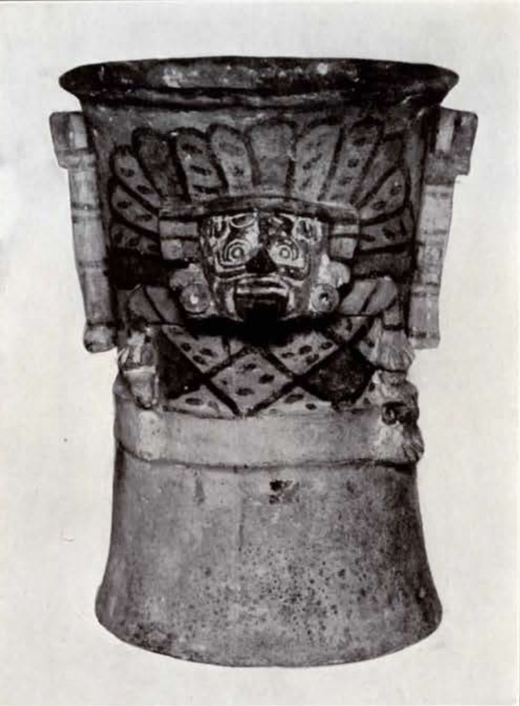 A censer or urn with a face in relief