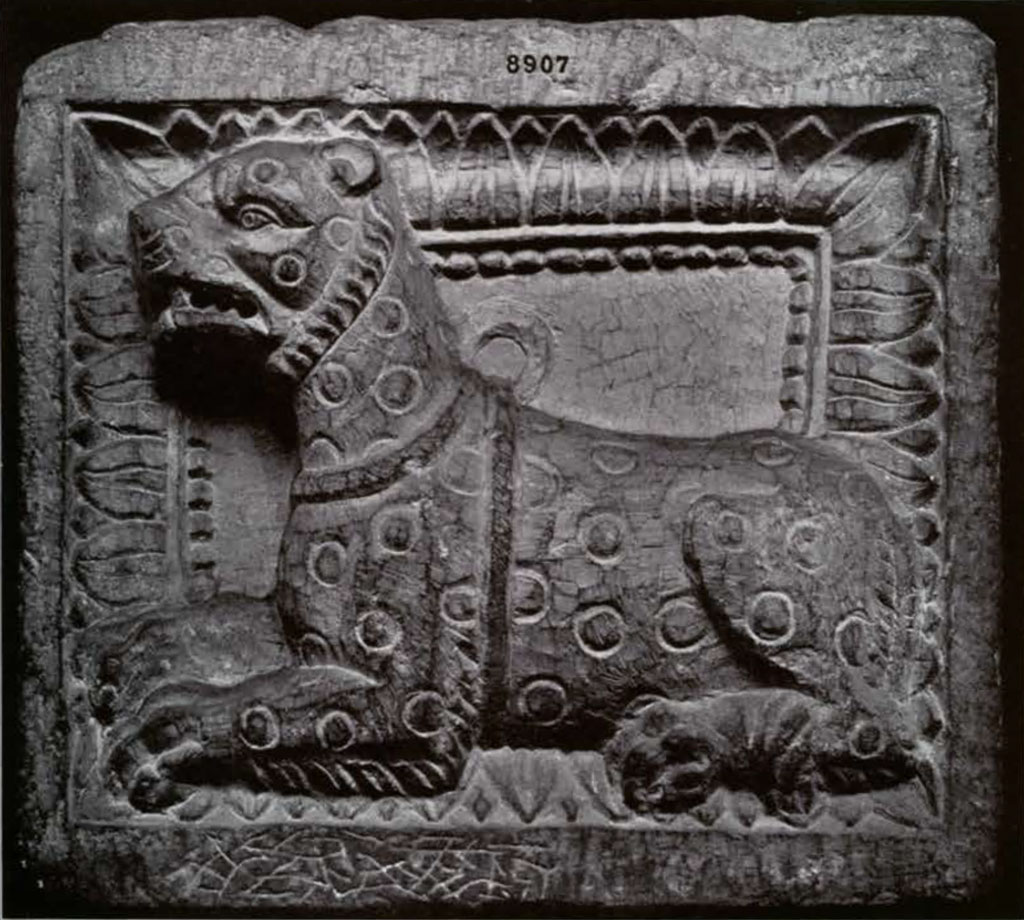 Relief showing a leopard laying down