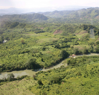 An aerial view of the Chama Valley, showing the tributary Tsalbha River just before it meets the Chixoy.