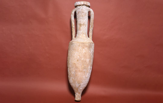 Ceramic amphora used to transport wine, two handles, tall basin and neck with large lip.